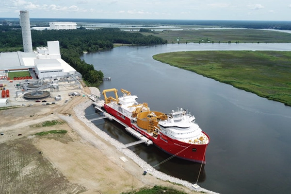 Large red ship docked in the Cooper River